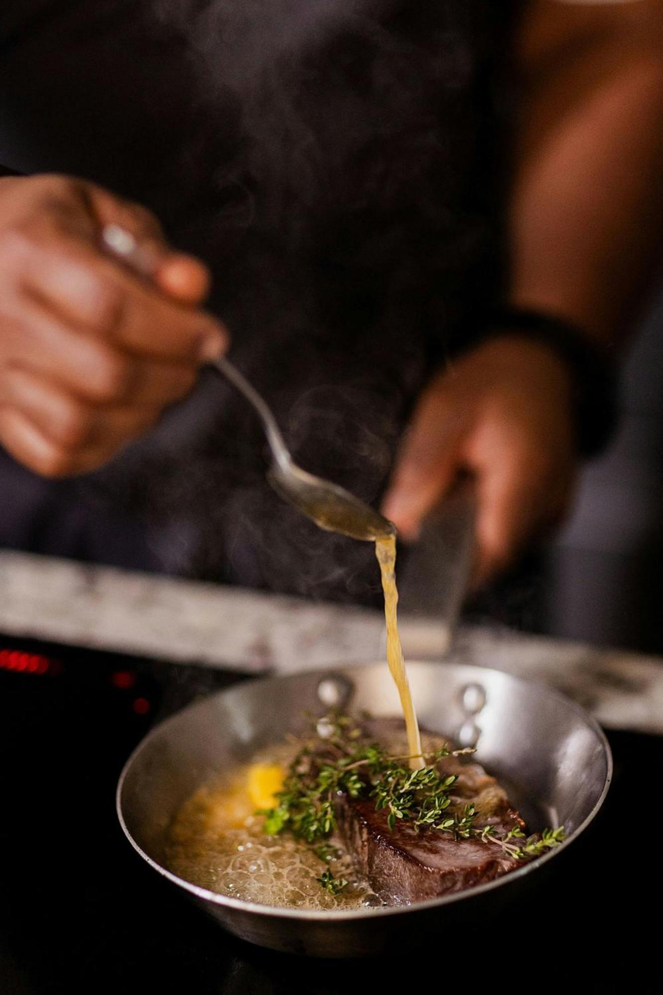 Stock Exchange Hotel, Manchester, Autograph Collection Экстерьер фото A chef seasoning a dish
